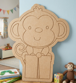 MDF DIY  monkey cutout on a table with a child's room in the background