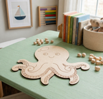 MDF DIY octopus cutout on a green table with books and toys in the background
