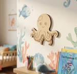 MDF DIY  octopus decoration on a wall with children's decor in the background