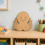 MDF DIY  octopus decoration on a shelf in a child's room with toys and books.