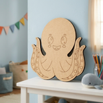 MDF DIY  octopus decoration on a shelf in a child's room with colorful flags in the background.