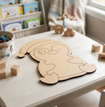DIY MDF cutout shaped like a cartoon character on a table with toys and books in the background