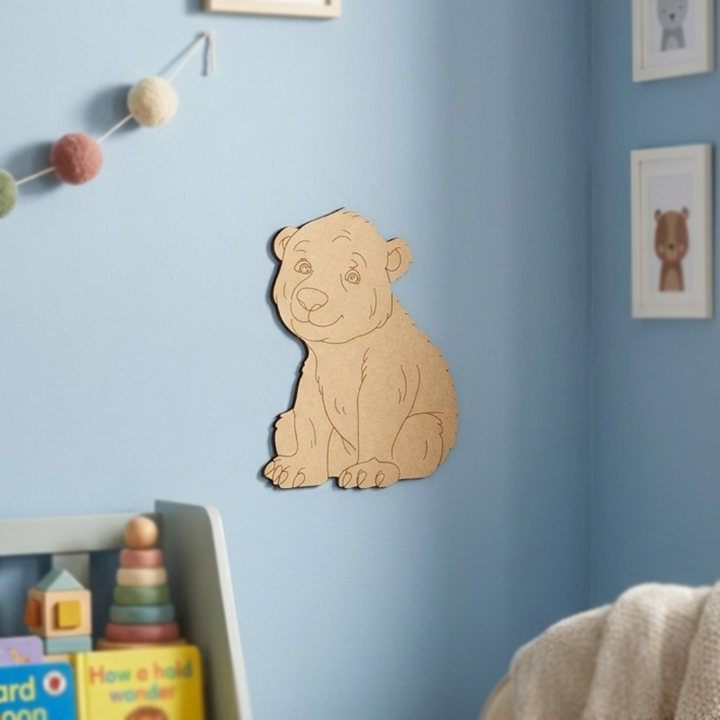 DIY MDF  bear decoration on a blue wall with children's toys below