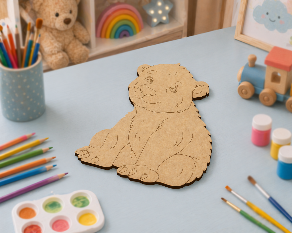 DIY MDF  Wooden bear cutout  on a table with art supplies