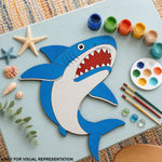 DIY MDF  shark cutout with painting supplies on a table