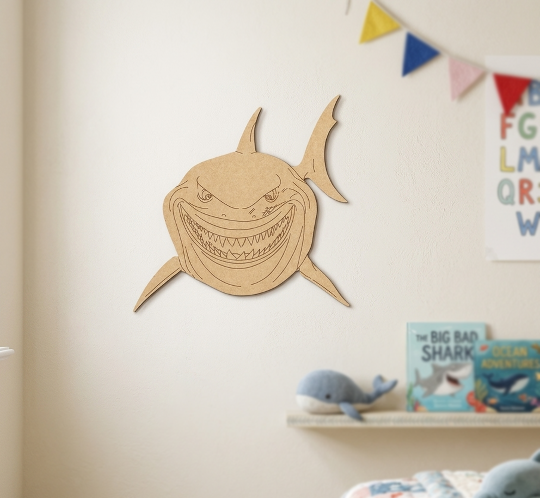 DIY MDF  shark cutout on a wall with children's books and toys below