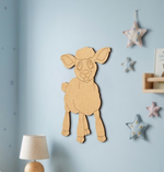 DIY MDF  sheep wall decoration on a light blue wall with star-shaped decorations.