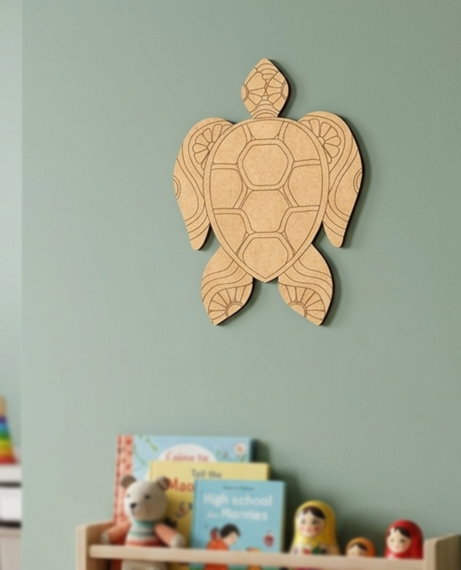 DIY MDF  turtle wall decoration on a light green wall with books and toys below.