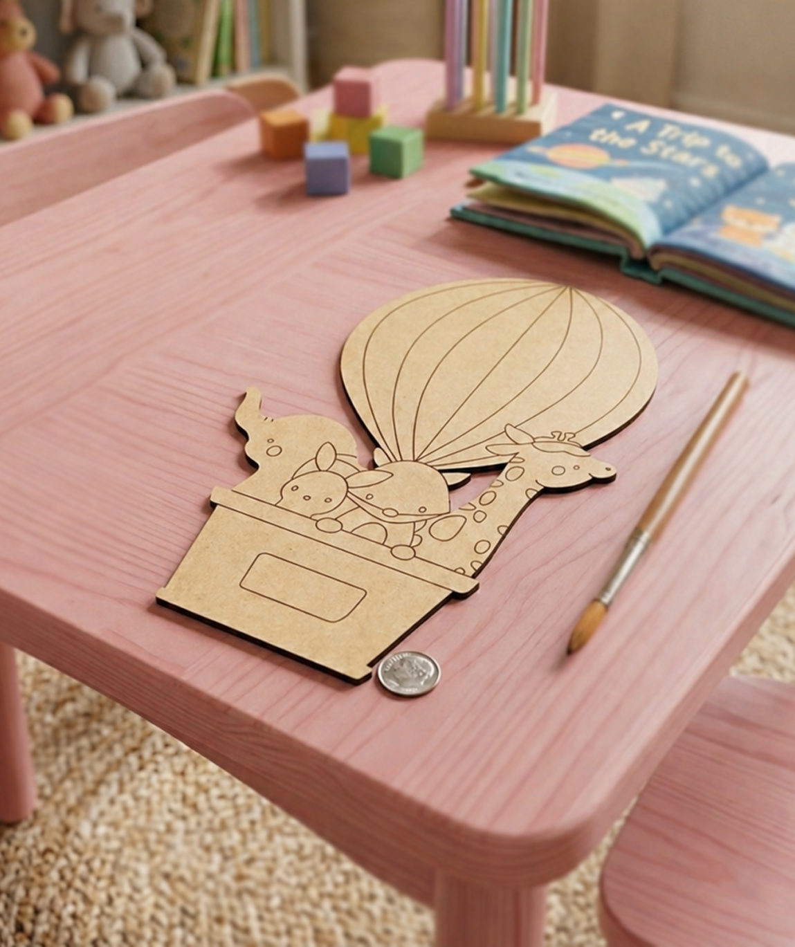 MDF DIY  craft project on a pink table with toys and books in the background