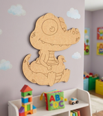 MDF DIY  alligator wall decoration in a child's room with toys and books.