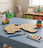 MDF DIY cutout of a crocodile on a table with art supplies in a child's playroom.