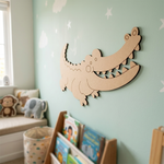 MDF DIY  alligator wall decoration in a child's room with books and toys.