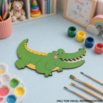 MDF DIY Children's craft activity with a crocodile-shaped paper cutout on a table with paint supplies.