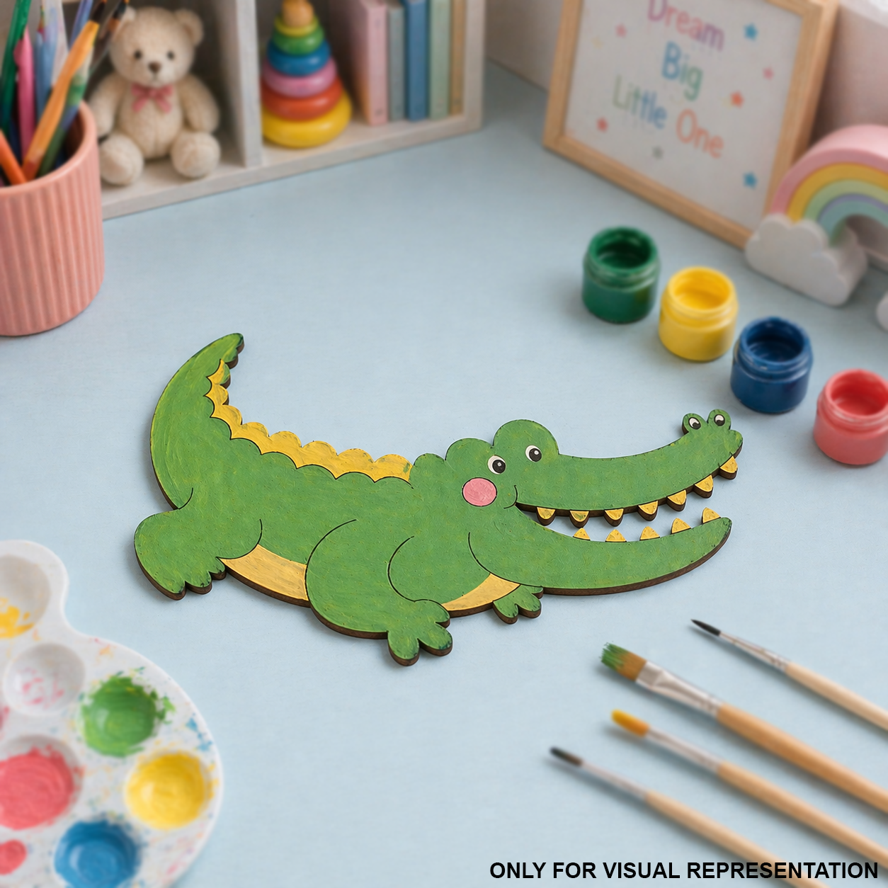 MDF DIY Children's craft activity with a crocodile-shaped paper cutout on a table with paint supplies.
