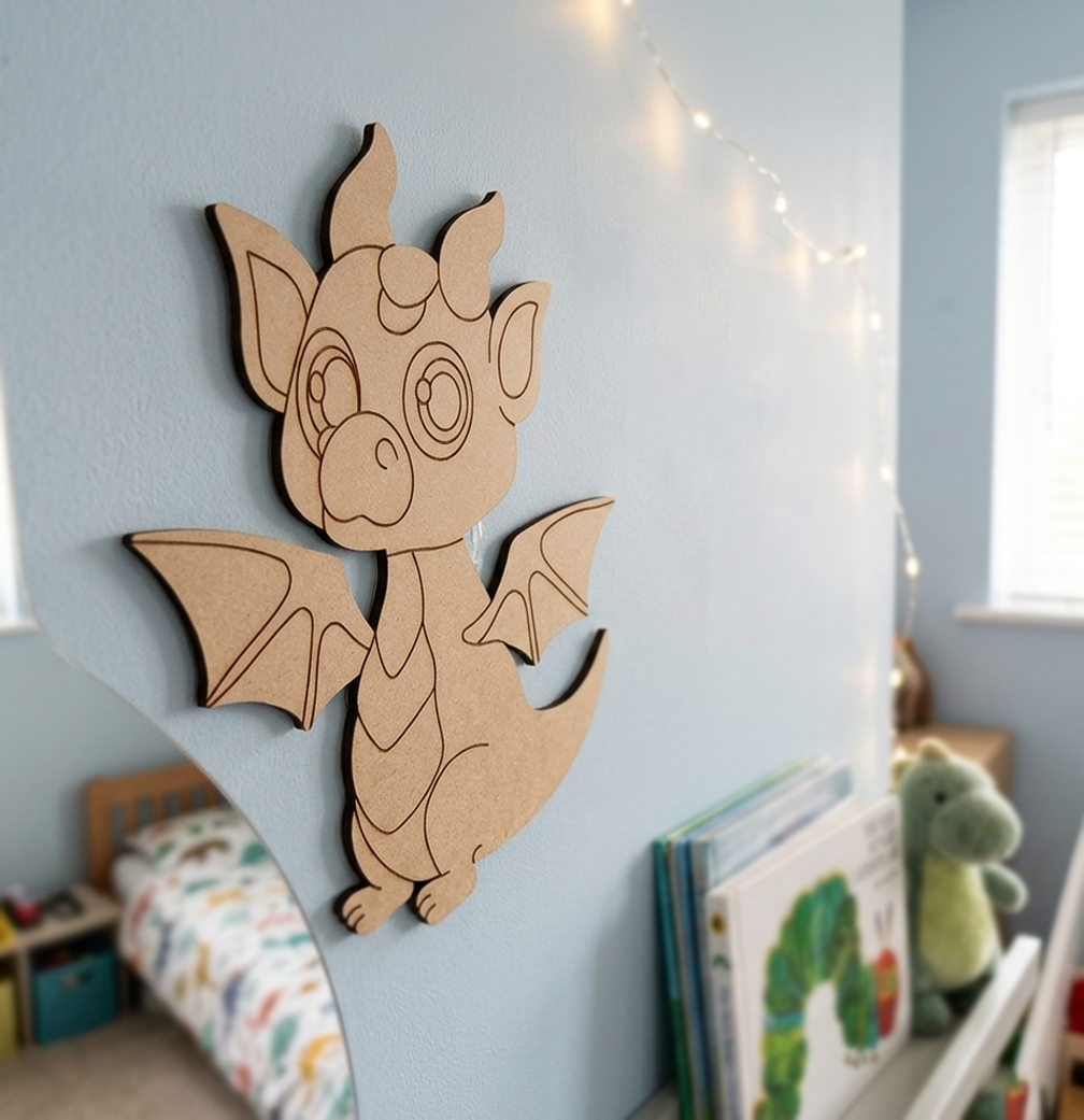 MDF DIY dragon wall decoration in a child's room with books and toys.
