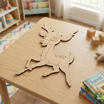 MDF DIY  deer cutout  on a table in a child's room with books and toys.