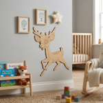 MDF DIY  deer wall decoration in a child's room with books and toys on a shelf.