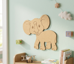 MDF DIY  elephant wall decoration on a light green wall with children's items below.