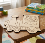 MDF DIY  train cutout on a wooden table with children's books and blocks in the background.