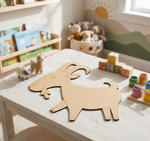 MDF DIY  goat toy on a table in a child's playroom with books and toys in the background.
