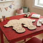 DIY MDF animal cutout  on a red table in a child's room with books and alphabet blocks.