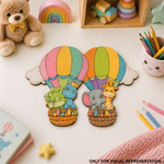 Colorful hot air balloon bookmarks with animals on a table with toys and stationery.