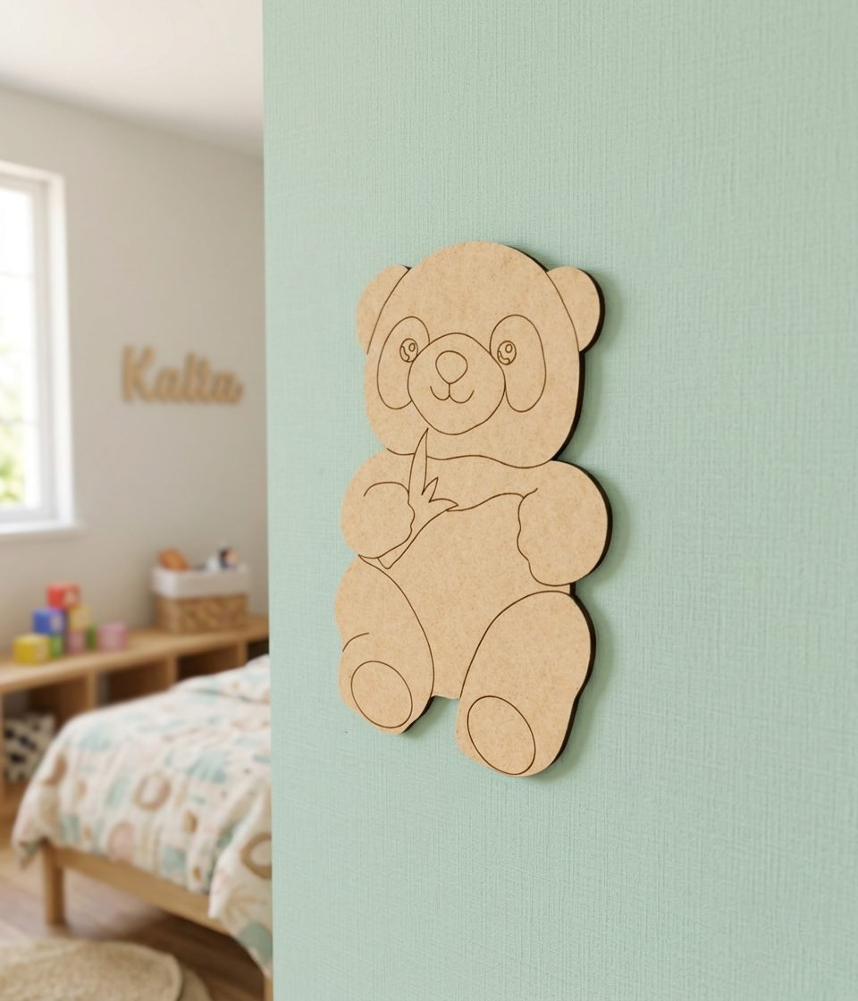 DIY MDF  panda cutout decoration on a light green wall with a child's room in the background.