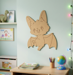 DIY MDF  bat-shaped wall decoration in a child's room with toys and books.