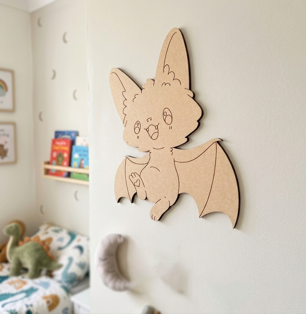 DIY MDF  bat-shaped wall decoration in a child's room with books and toys.