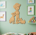 MDF DIY wall decoration of a boy with two dogs on a green wall with framed pictures.