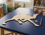 MDF DIY animal puzzle on a blue table with toys in the background