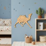 MDF DIY camel wall decoration in a room with a blue wall, sofa, and shelves.
