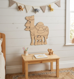 MDF DIY camel wall decoration in a child's room with a small table and decor items.