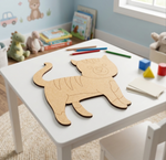 MDF DIY cat puzzle on a child's table with toys and books in the background