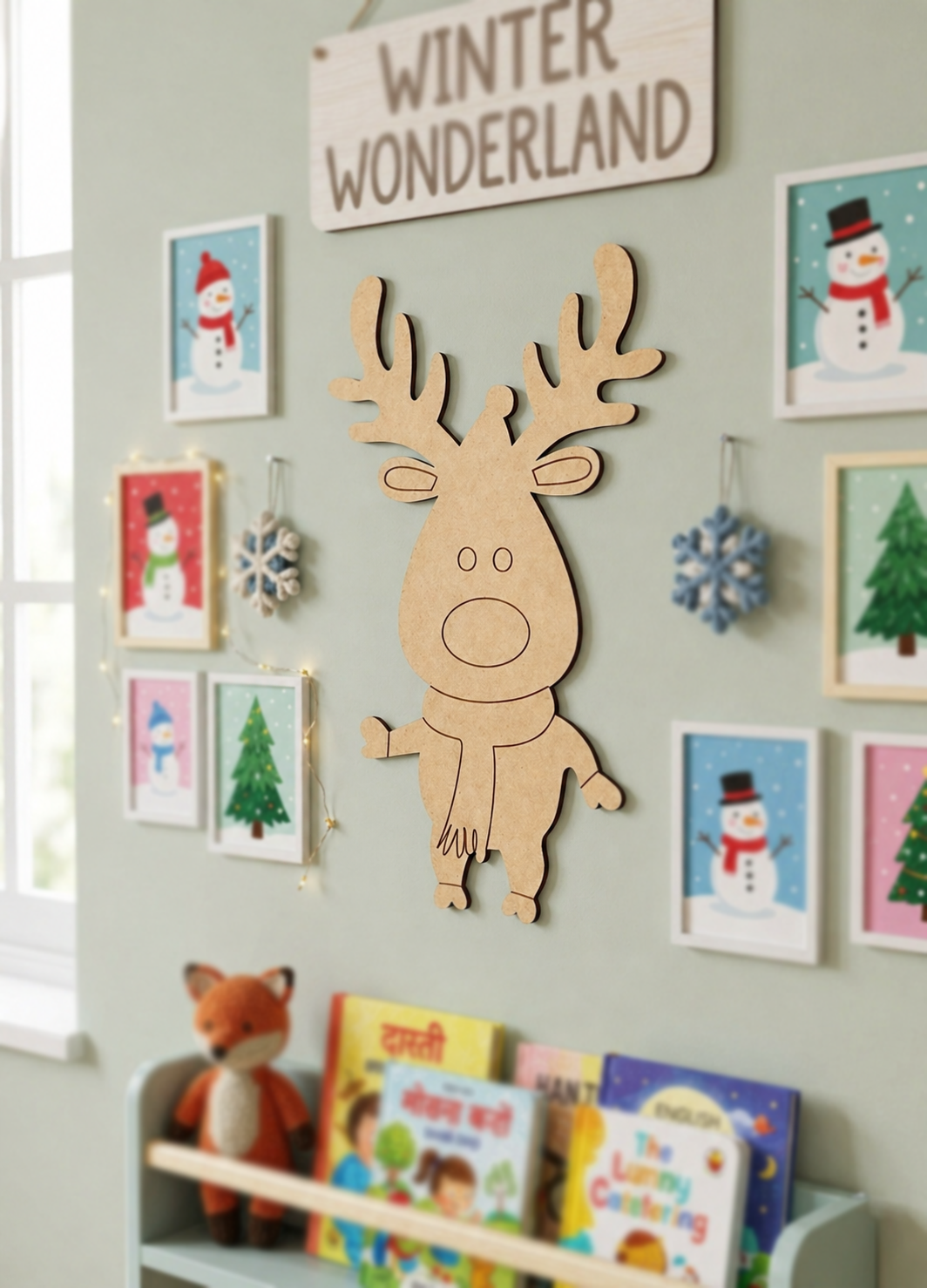 Children's room with MDF DIY reindeer decoration, framed pictures, and books on a shelf.