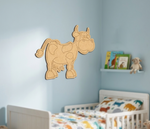 MDF DIY  cow wall decoration in a child's bedroom with books and toys on a shelf.