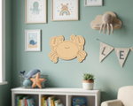 Children's room with MDF DIY wall art, framed pictures, and decorative items on a green wall.