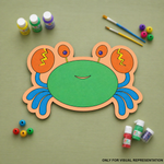 Colorful MDF DIY crab craft with painting supplies on a green background