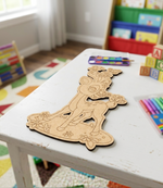 MDF DIY deer puzzle on a white table with colorful children's toys in the background