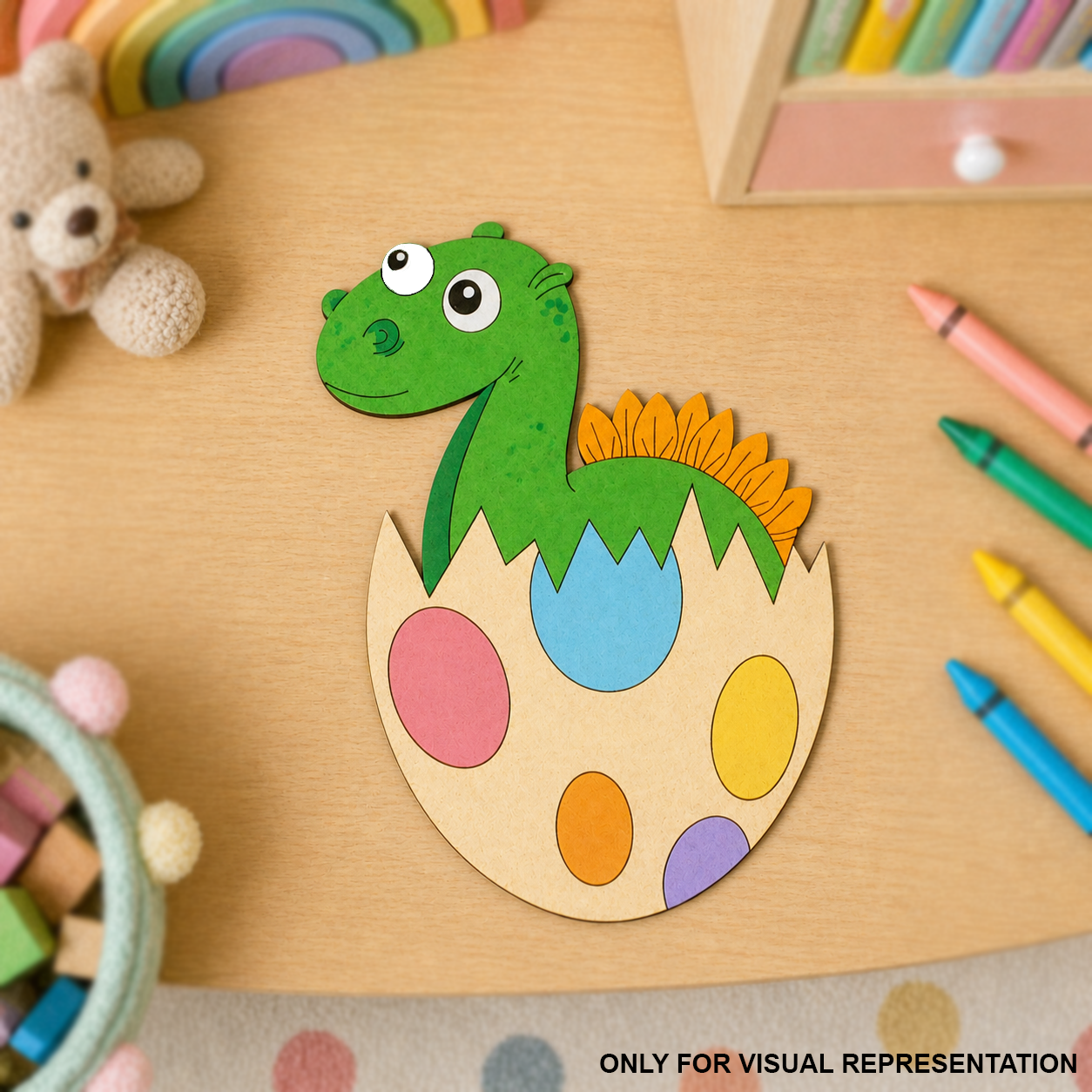 MDF DIY  Colorful dinosaur egg craft on a wooden table with crayons and a teddy bear.