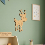 MDF DIY reindeer decoration on a green wall with a blurred background