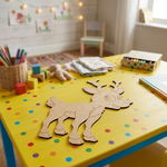 MDF DIY reindeer decoration on a polka dot table with a child's play area in the background.