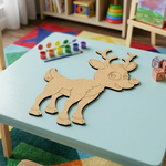 MDF DIY reindeer puzzle on a child's table with colorful toys in the background