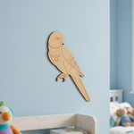 MDF DIY  parrot decoration on a light blue wall with a child's room in the background.