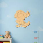MDF DIY parrot cutout decoration on a blue wall with a teddy bear and books below.