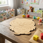 MDF DIY  owl craft on a table with colorful children's toys in a classroom setting