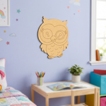 Unpainted owl MDF wall hanging displayed on a nursery wall above a children's bookshelf.