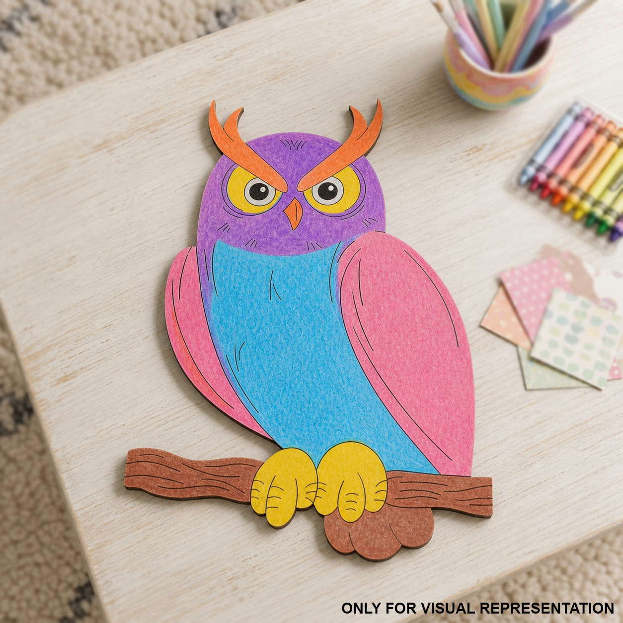 MDF DIY colorfull owl cutout on a table.