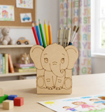 MDF DIY  elephant pencil holder with colorful pencils on a table in a child's room.