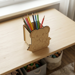 MDF DIY pencil holder shaped like a bear with colorful pencils on a wooden surface.